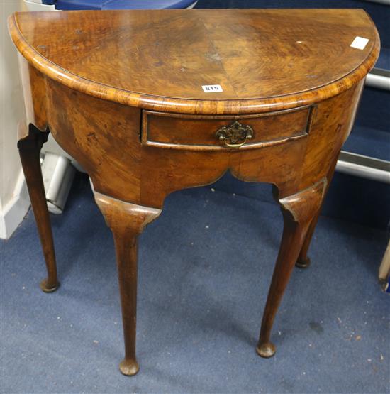 A George I style walnut demi lune table W.76cm
